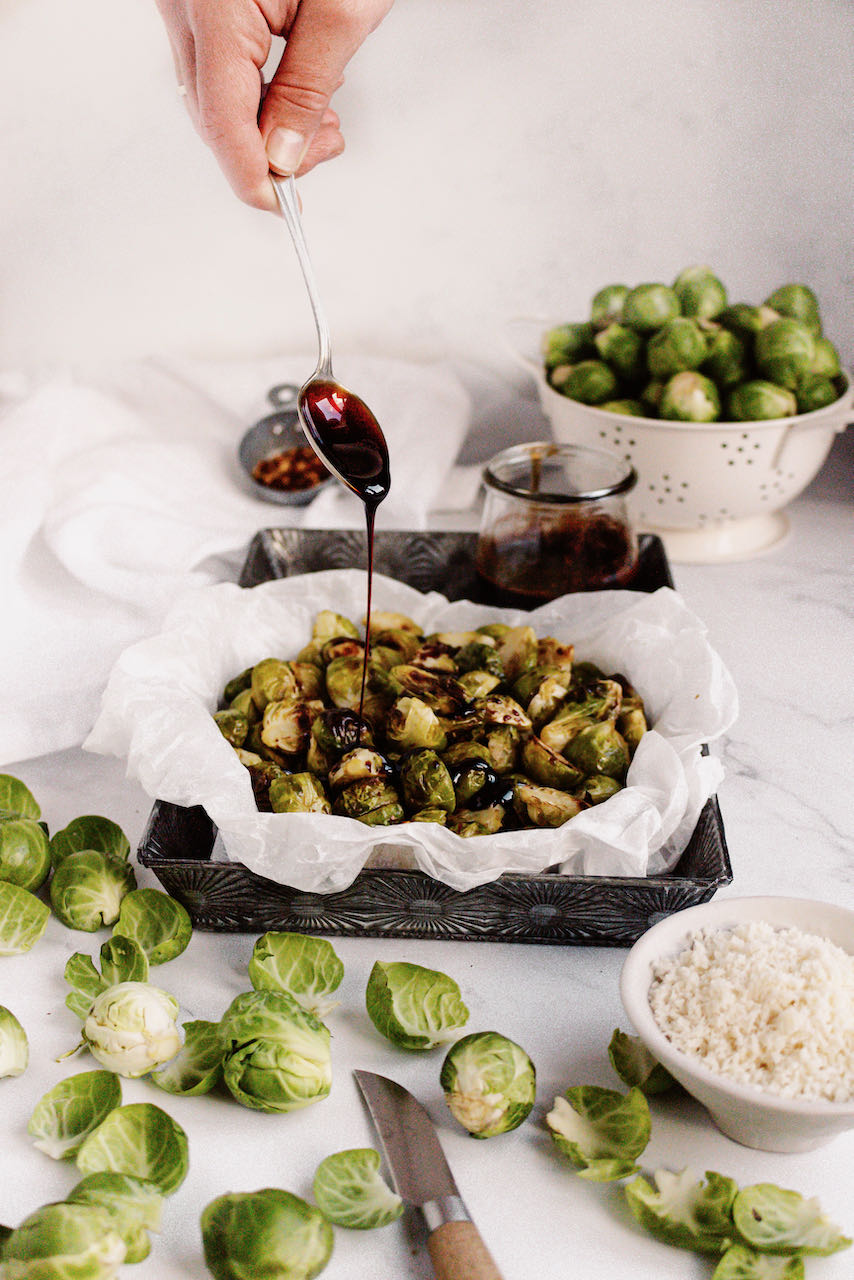 Roasted Brussels sprouts drizzling with balsamic reduction