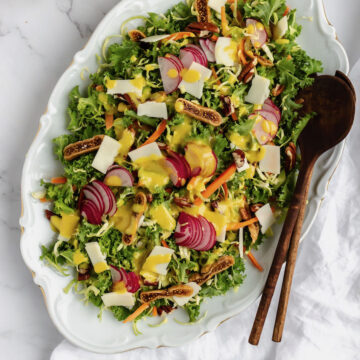 Kale & Brussels sprouts salad with dressing flatlay