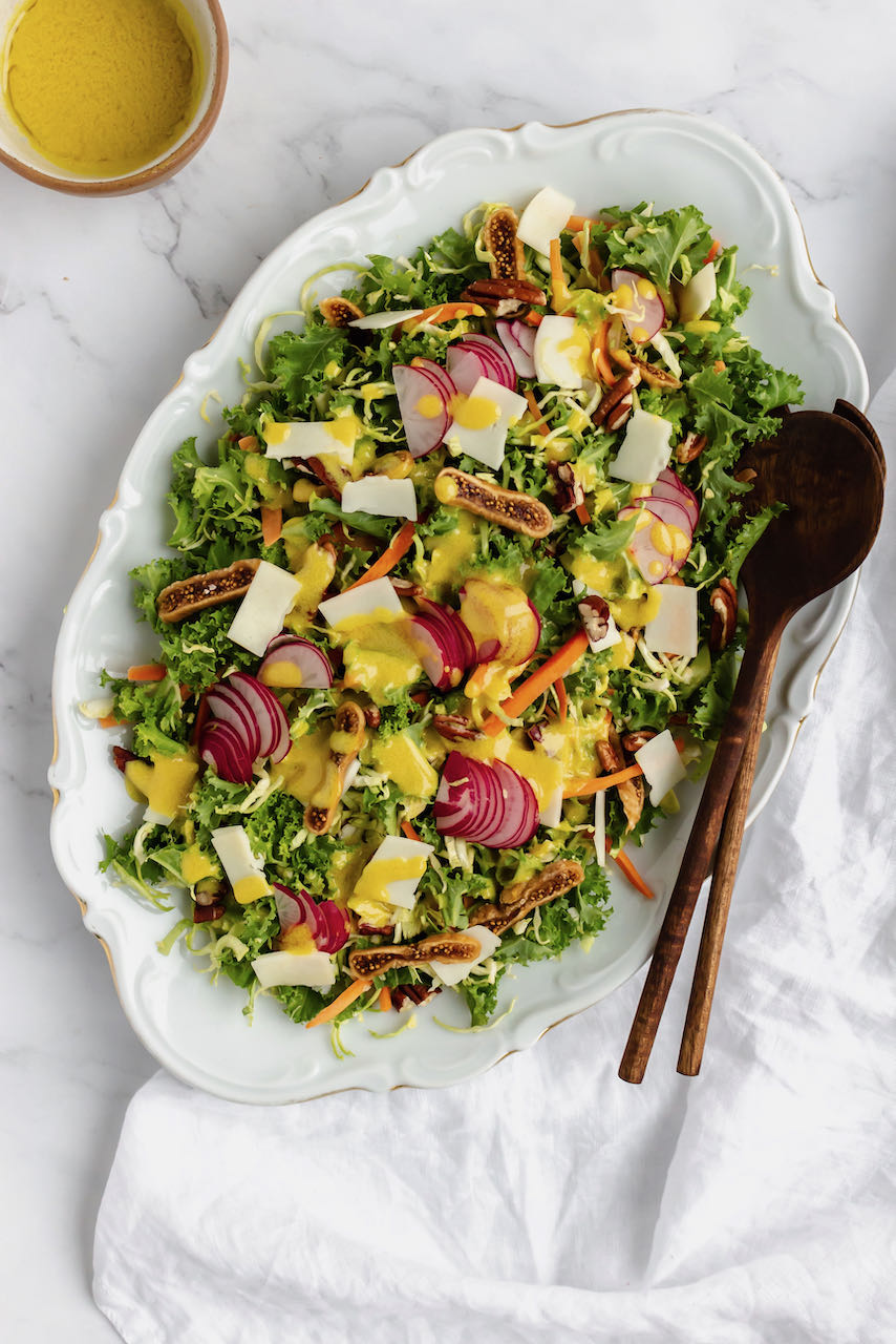 Kale & Brussels sprouts salad with dressing flatlay